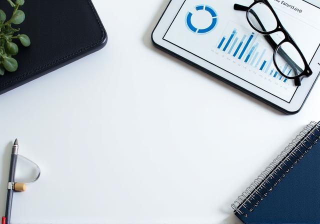 Regulatory compliance checklist and digital security icons on a desk